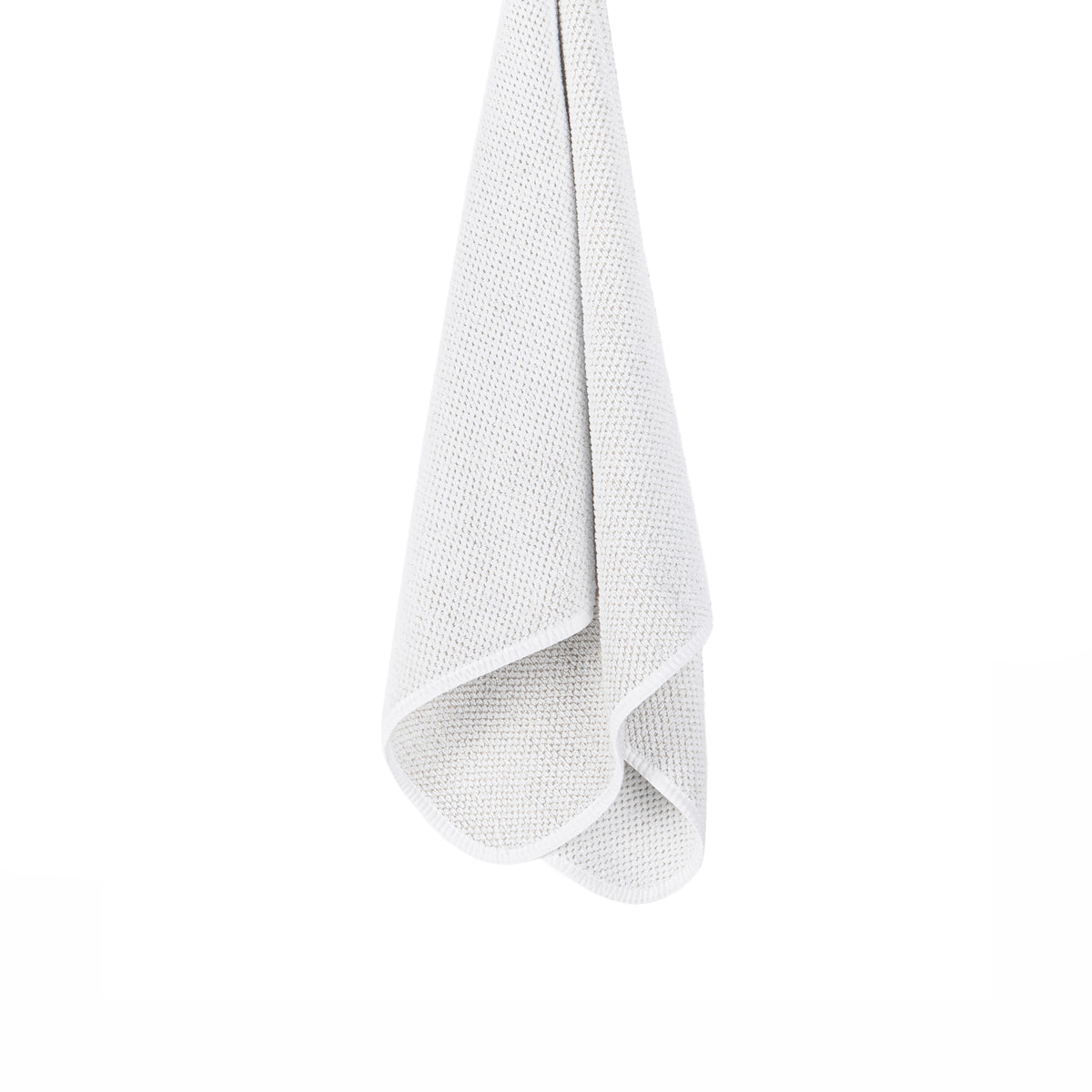 A white textured microfiber cloth hanging vertically against a solid white background.